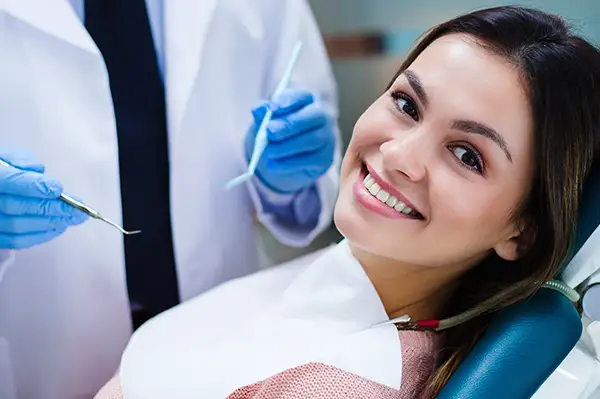 Beautiful young woman looking at camera with smile in East Portland Dentistry